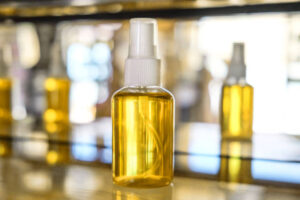 Close up shot of Moroccan Argan oil in plastic spray bottle Scalp Care Serum